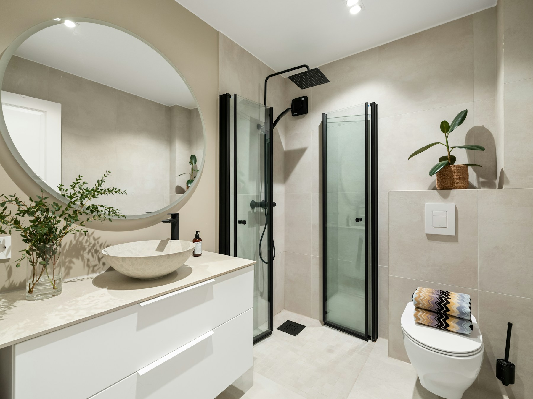 Contemporary bathroom interior with basin and glass shower. Independent design reference, not a supplied project.